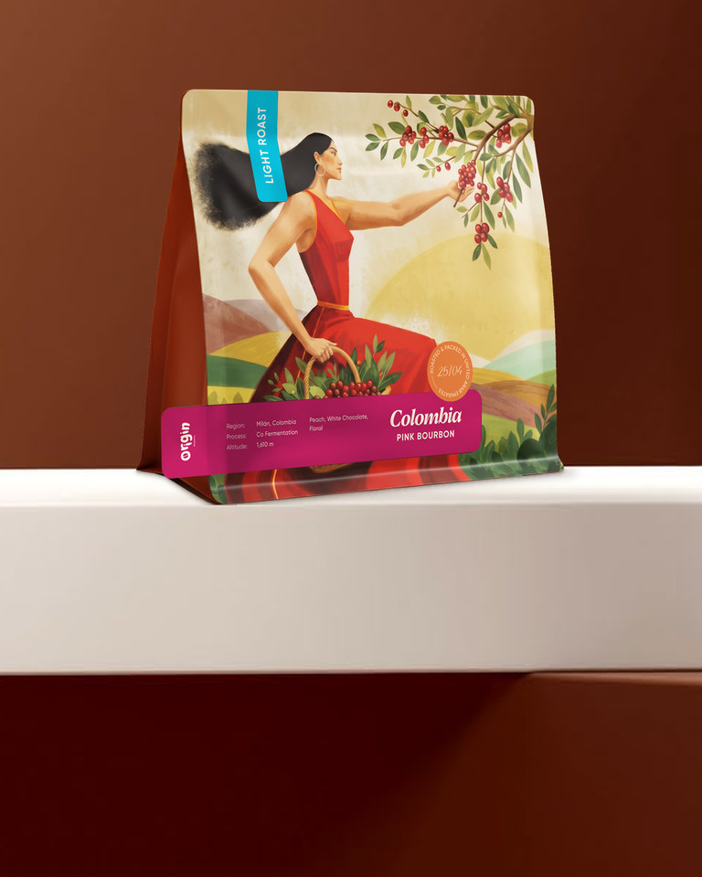 Origin Roastery Colombia Pink Bourbon coffee bag on a white marble platform